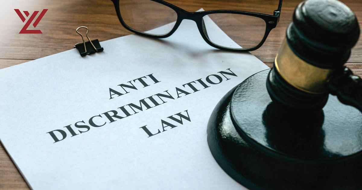 Document reading "Anti Discrimination Law" next to a gavel and glasses