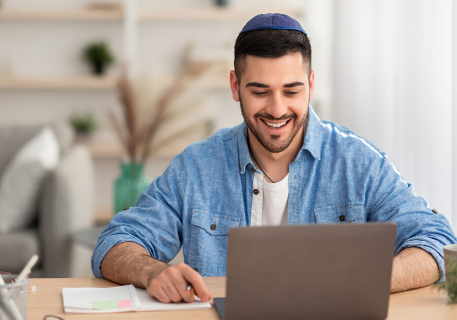 Smiling man on computer