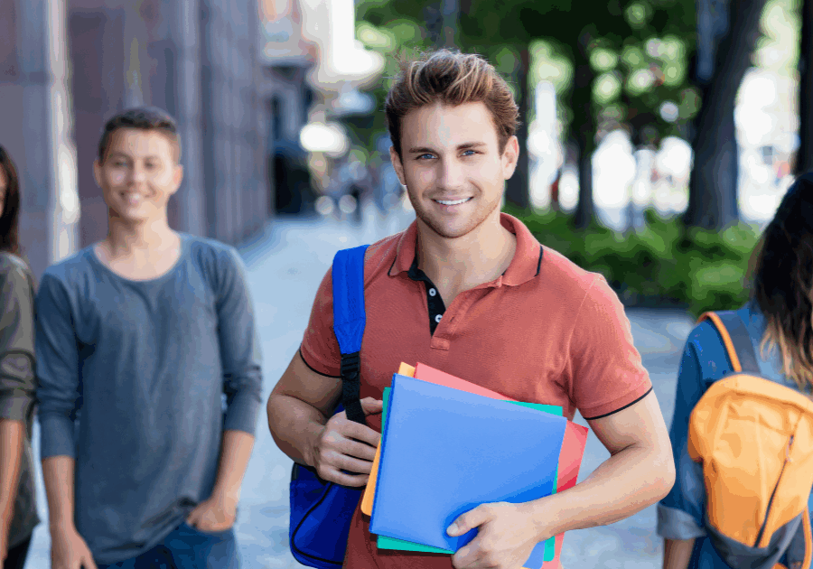 Students walking with backpacks and notebooks